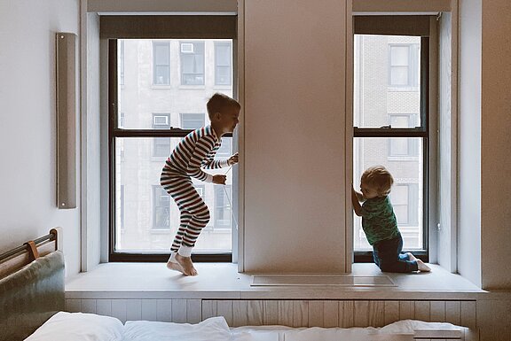 Two Kids two-kids-playing-beside-glass-windows-3273851.jpg